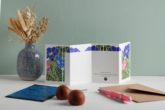 Reverse side of Morning Glory in Bloom Garland card showing blank writing space. Hand-carved botanical design continues on back of concertina card, 300gsm recycled FSC certified cardstock, room for personal message.