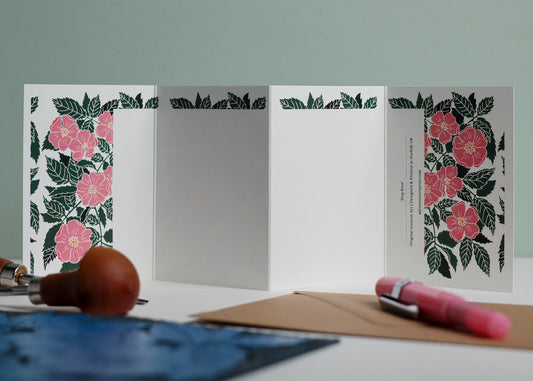 Reverse side of Dog Rose Garland card showing blank writing space. Hand-carved botanical design continues on back of concertina card, 300gsm recycled FSC certified cardstock, room for personal message.