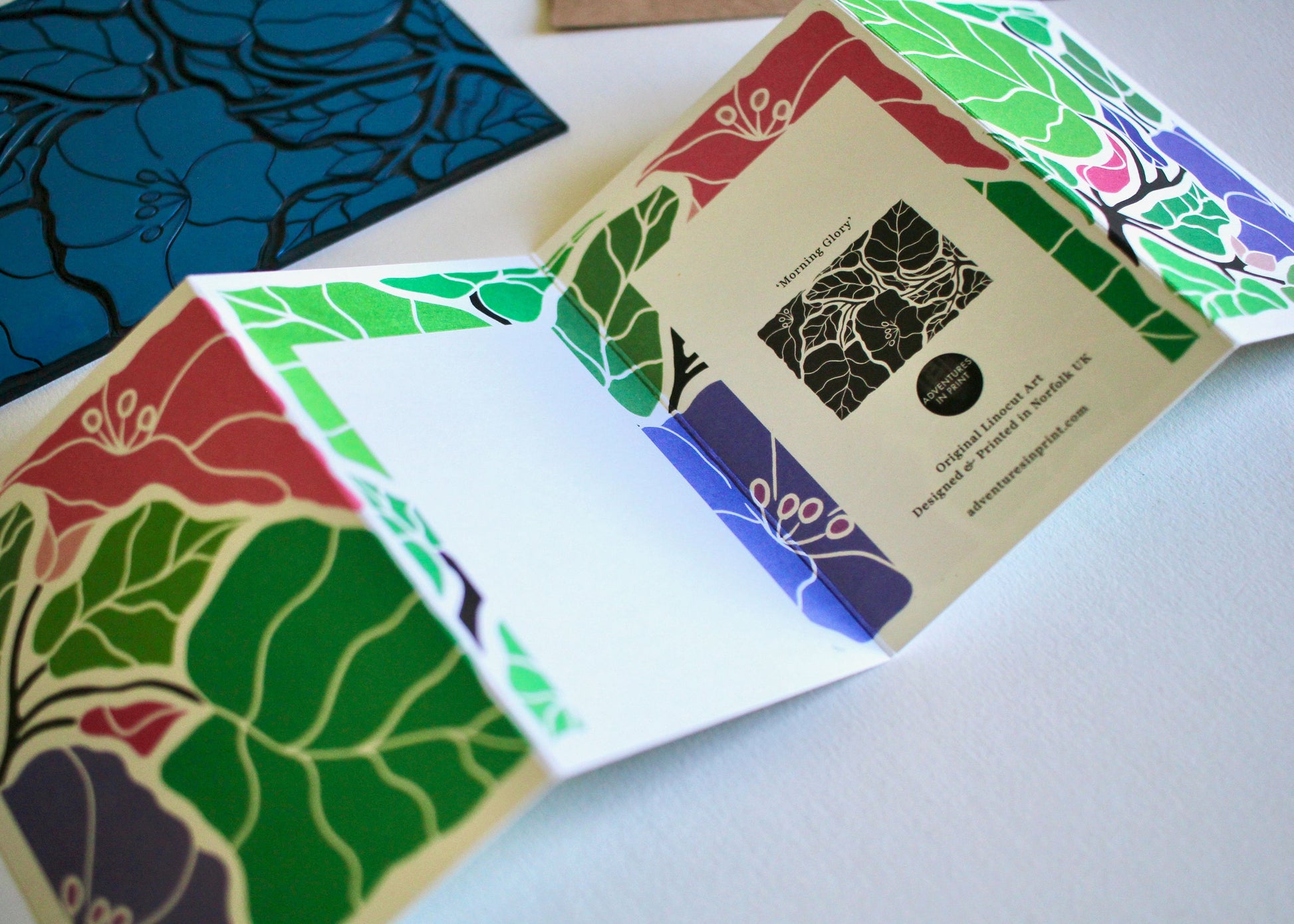 A linocut concertina greeting card carefully printed in small batches and folded by hand
