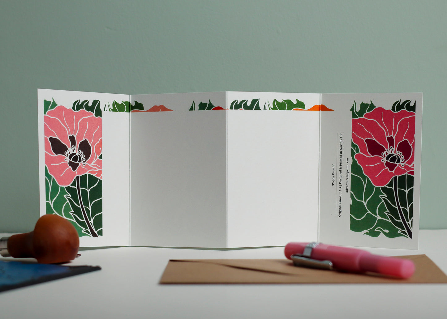 Reverse side of Poppy Parade Garland card showing blank writing space. Hand-carved botanical design continues on back of concertina card, 300gsm recycled FSC certified cardstock, room for personal message.