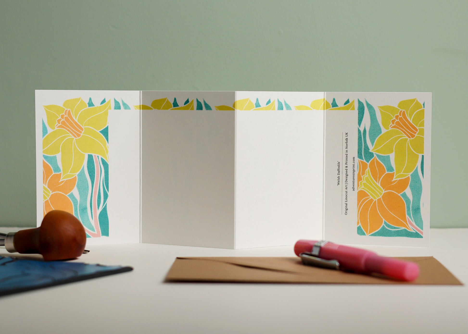 Reverse side of Welsh Daffodil Garland card showing blank writing space. Hand-carved botanical design continues on back of concertina card, 300gsm recycled FSC certified cardstock, room for personal message.
