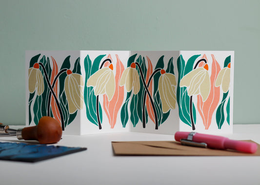 Snowdrop botanical Garland card shown fully extended (105 x 297mm), displaying complete hand-carved linocut design. Modern cottagecore snowdrop portrait, perfect for mantlepiece display.