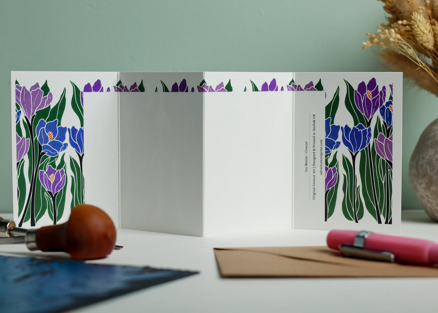 Reverse side of Crocus Garland card showing blank writing space. Hand-carved botanical design continues on back of concertina card, 300gsm recycled FSC certified cardstock, room for personal message.