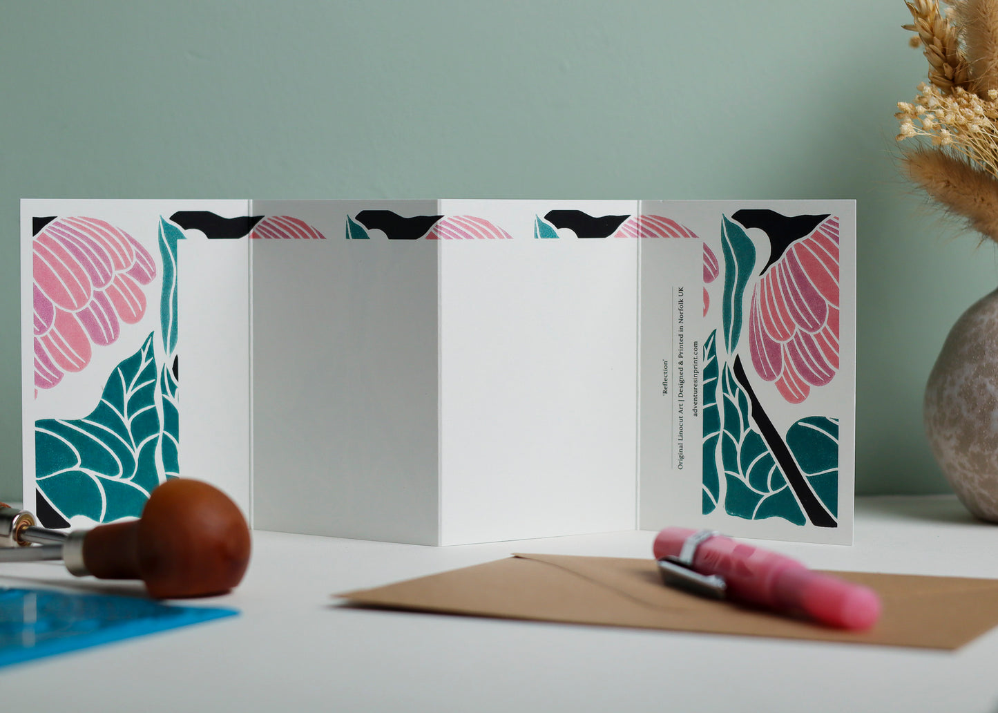 Reverse side of Reflection Garland card showing blank writing space. Hand-carved botanical design continues on back of concertina card, 300gsm recycled FSC certified cardstock, room for personal message.