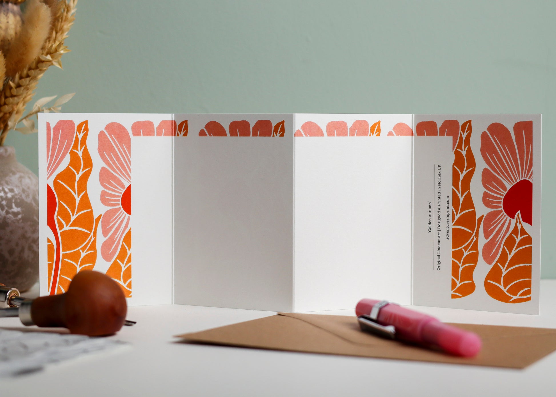 Reverse side of Golden Autumn Garland card showing blank writing space. Hand-carved botanical design continues on back of concertina card, 300gsm recycled FSC certified cardstock, room for personal message.