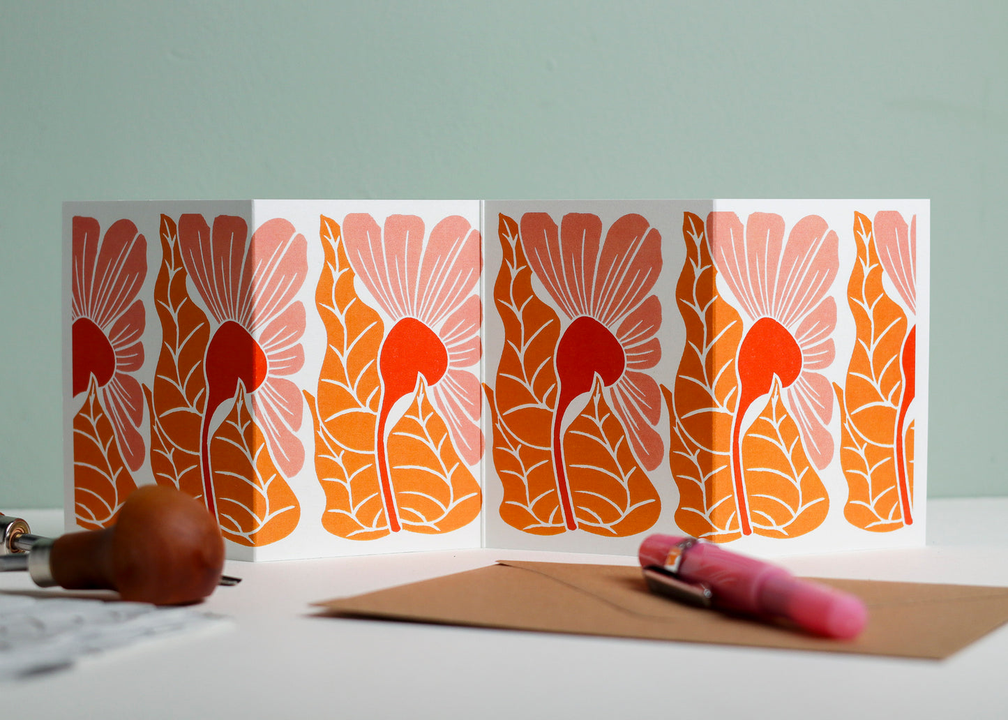 Golden Autumn botanical Garland card shown fully extended (105 x 297mm), displaying complete hand-carved linocut design. Modern cottagecore abstract flower portrait, perfect for mantlepiece display