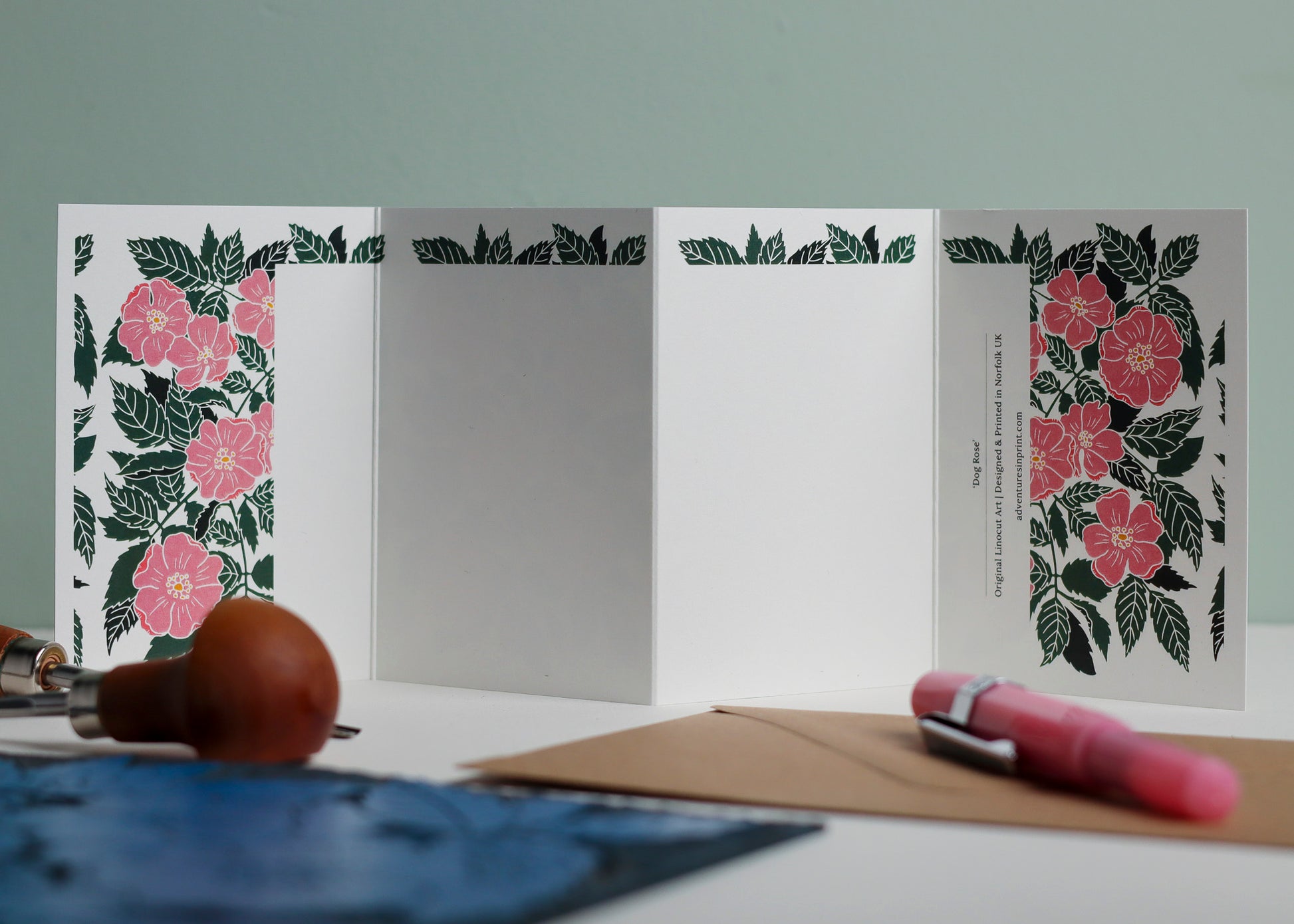 Reverse side of Dog Rose Garland card showing blank writing space. Hand-carved botanical design continues on back of concertina card, 300gsm recycled FSC certified cardstock, room for personal message.