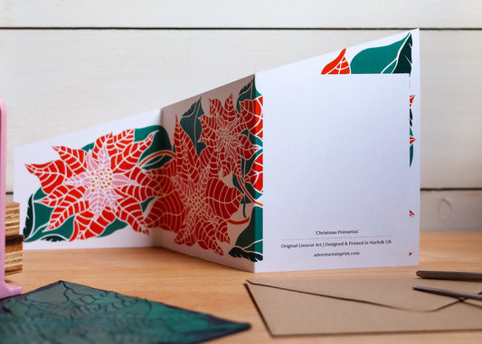 Double-sided festive poinsettia card showing blank space on reverse for handwritten holiday messages
