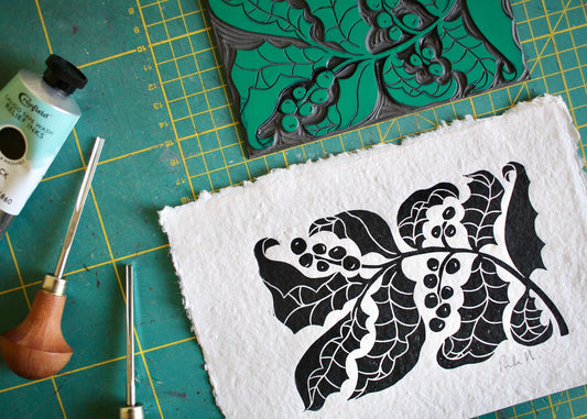 hand printed holly linocut on cotton rag paper