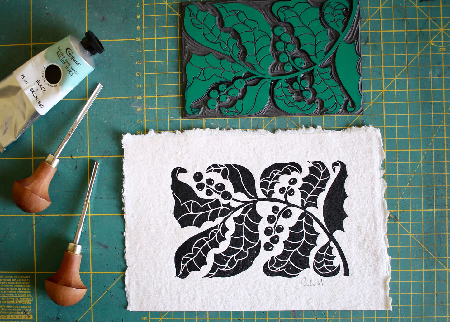 holly linocut hand printed onto handmade paper