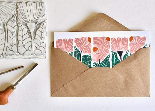 Landscape DL greeting card featuring modern linocut flowers in a delicate peach colour palette