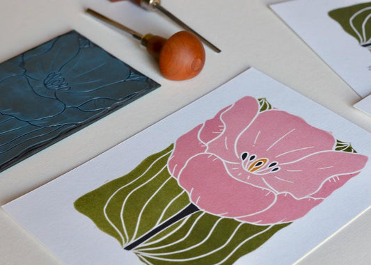 This art print features a large single tulip in bloom, in a soft romantic pink colour and was created using traditional linocut techniques.