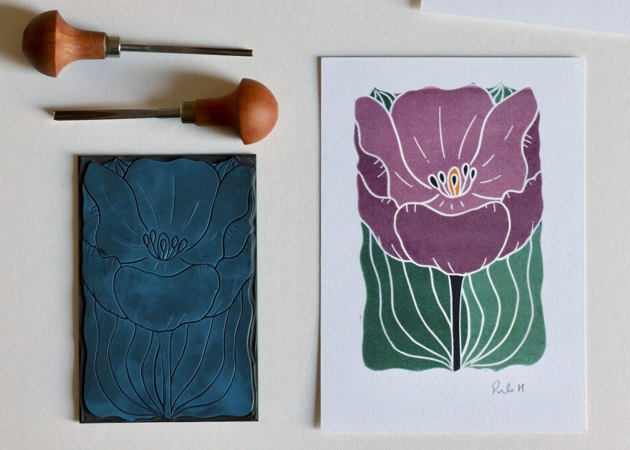 This art print features a royal purple large single tulip created using traditional linocut techniques.