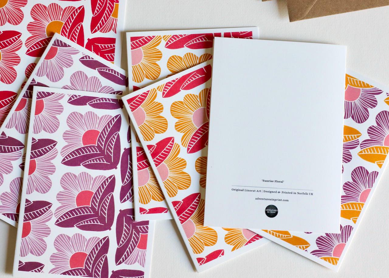 Detail shot highlighting the premium cardstock quality and crisp printing of the abstract floral linocut design in morning-inspired color palette