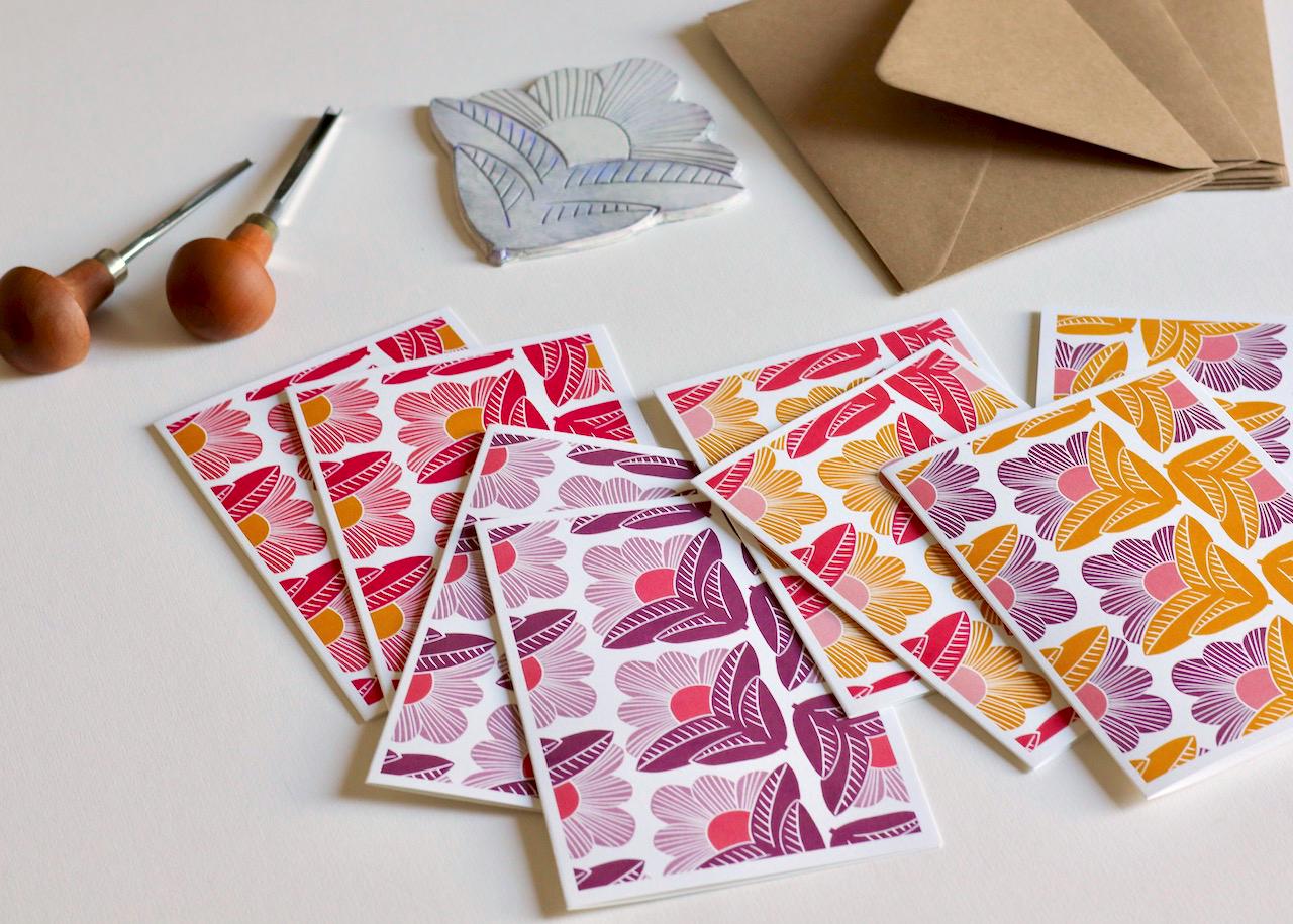 Artistic stationery featuring original linocut design of abstracted morning flowers, showing the texture and depth of hand-printed artwork